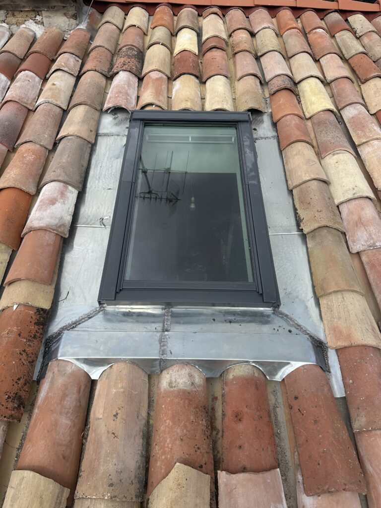 Pose d'un velux Toulousain après